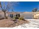 Charming single-story home with desert landscaping and a two-car garage at 1905 Sirocco Ct, Las Vegas, NV 89117