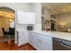 Contemporary kitchen with stainless steel dishwasher and sink overlooking dining room at 1905 Sirocco Ct, Las Vegas, NV 89117