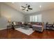 Comfortable living room with a vaulted ceiling, hardwood floors, and cozy sectional sofa at 1905 Sirocco Ct, Las Vegas, NV 89117