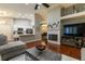 Spacious living area with a fireplace and seamless flow into the kitchen and dining space at 1905 Sirocco Ct, Las Vegas, NV 89117