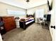 Bedroom with carpeted floors, bright windows, a modern bed, and a computer desk at 1908 Linden Ave, Las Vegas, NV 89101