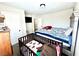 Bedroom features a modern crib, dresser, and soft carpeting at 1908 Linden Ave, Las Vegas, NV 89101