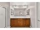 Bathroom featuring dual sinks, a large mirror, and a glass-enclosed shower at 1968 Granemore St, Las Vegas, NV 89135