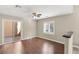 Bedroom with hard wood floors, ceiling fan, neutral paint, and windows providing natural light at 1968 Granemore St, Las Vegas, NV 89135