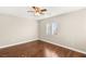 This bedroom is filled with natural light with a ceiling fan and hardwood floors at 1968 Granemore St, Las Vegas, NV 89135