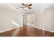 Bedroom with hard wood floors, ceiling fan, neutral paint, and sliding glass doors at 1968 Granemore St, Las Vegas, NV 89135