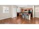 Cozy kitchen with dark wood cabinets, stainless steel appliances, and a breakfast bar at 1968 Granemore St, Las Vegas, NV 89135