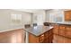 This kitchen features an island with bar seating and sleek, modern cabinets at 1968 Granemore St, Las Vegas, NV 89135