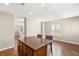 Kitchen island with bar stool seating and hardwood floors at 1968 Granemore St, Las Vegas, NV 89135