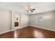 An airy main bedroom with a ceiling fan and view into an ensuite bathroom at 1968 Granemore St, Las Vegas, NV 89135