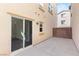 Exterior patio with an access door and concrete floor at 1968 Granemore St, Las Vegas, NV 89135