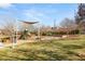 Community playground features slides, swings and covered seating area at 1968 Granemore St, Las Vegas, NV 89135