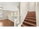 A naturally lit staircase leads to the second story and overlooks the loft area at 1968 Granemore St, Las Vegas, NV 89135