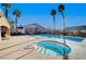 Outdoor shot of the community hot tub next to the pool surrounded by palm trees at 209 Roxborough St, Henderson, NV 89074