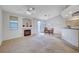 Spacious living area featuring neutral carpet, fireplace, dining area and lots of light at 209 Roxborough St, Henderson, NV 89074