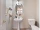 Powder room with pedestal sink, and tile flooring at 2325 Windmill Pkwy # 323, Henderson, NV 89074