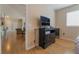 Hardwood bedroom with black dresser and an open view into other living areas at 2325 Windmill Pkwy # 323, Henderson, NV 89074