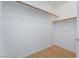 Walk-in closet with wood floors and shelving at 2325 Windmill Pkwy # 323, Henderson, NV 89074