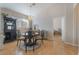 Cozy dining room features wood floors, stylish light fixture, and adjacent built-in storage cabinet at 2325 Windmill Pkwy # 323, Henderson, NV 89074