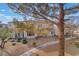 Well-maintained condo showcasing neutral-toned exterior, a red tile roof, and established landscaping at 2325 Windmill Pkwy # 323, Henderson, NV 89074