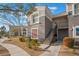 Exterior view of a two-story home with well-maintained landscaping and a sidewalk at 2325 Windmill Pkwy # 323, Henderson, NV 89074