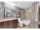 Cozy bathroom featuring a shower-tub combo and a vanity with granite countertops at 2451 N Rainbow Blvd # 1006, Las Vegas, NV 89108