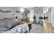 Neutral bedroom with wood floors and decor, featuring cat accessories and bicycles at 2451 N Rainbow Blvd # 1006, Las Vegas, NV 89108