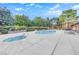 Community pool area with a swimming pool, hot tub, and lounge chairs at 2451 N Rainbow Blvd # 1006, Las Vegas, NV 89108