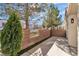 Backyard with block wall, some greenery, and a patio area at 3137 Sunrise Cove Ave, North Las Vegas, NV 89031