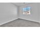 A bedroom with a single window and carpet flooring at 3137 Sunrise Cove Ave, North Las Vegas, NV 89031