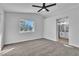 Spacious main bedroom with a ceiling fan leading to an ensuite bathroom at 3137 Sunrise Cove Ave, North Las Vegas, NV 89031