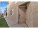 Front door and sidewalk with small lawn at 3137 Sunrise Cove Ave, North Las Vegas, NV 89031