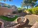 Unique backyard featuring a decorative rock garden, gravel ground cover, and mature landscaping at 3337 Autumn Veil St, Las Vegas, NV 89129