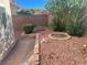 Charming backyard featuring brick-lined walkways and planting areas with mature foliage at 3337 Autumn Veil St, Las Vegas, NV 89129