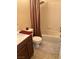 Bathroom featuring a shower and tub combo with a dark wood vanity and light tile flooring at 3337 Autumn Veil St, Las Vegas, NV 89129