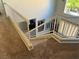 Carpeted staircase with white railings offering an overview of the living space below at 3337 Autumn Veil St, Las Vegas, NV 89129