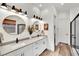 Elegant bathroom with double sinks, modern fixtures, and a glass-enclosed shower at 343 American Dipper St, Las Vegas, NV 89138