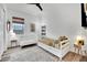 Bright bedroom featuring a daybed, a crib, neutral rug and a window at 343 American Dipper St, Las Vegas, NV 89138