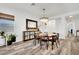 Bright dining room features a round table, modern chandelier, and stylish decor at 343 American Dipper St, Las Vegas, NV 89138