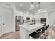 Modern kitchen featuring a large island with a marble countertop and stainless steel appliances at 343 American Dipper St, Las Vegas, NV 89138