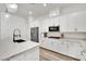 Bright kitchen featuring white cabinets, stainless steel appliances, and a marble countertop island at 343 American Dipper St, Las Vegas, NV 89138