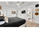 Bright main bedroom with decorative rug, tray ceiling, and en-suite bathroom at 343 American Dipper St, Las Vegas, NV 89138