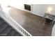 View of the living room featuring laminate floors, a fireplace, and a desk space that gives a good home office feel at 3539 Japan Way, Las Vegas, NV 89115