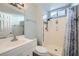 A bathroom with a white cabinet, toilet, mirror, and a shower with a curtain at 3675 Winner Dr, Las Vegas, NV 89120