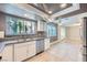 A cozy kitchen features stainless steel appliances and a large garden view window at 3675 Winner Dr, Las Vegas, NV 89120