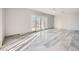 A bright living room with tile floor and lots of natural light from the sliding doors at 3675 Winner Dr, Las Vegas, NV 89120