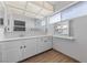 Bright bathroom featuring tile flooring, cabinetry and ample mirrors at 4272 E Russell Rd, Las Vegas, NV 89120