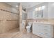 Tiled bathroom featuring walk in shower, toilet, and vanity with cabinet storage at 4272 E Russell Rd, Las Vegas, NV 89120