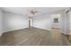 Main bedroom features wood-look floors, a ceiling fan, and an ensuite bathroom at 4272 E Russell Rd, Las Vegas, NV 89120