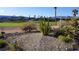 Landscaped backyard with desert plantings and golf course views at 5059 Pensier St, Las Vegas, NV 89135